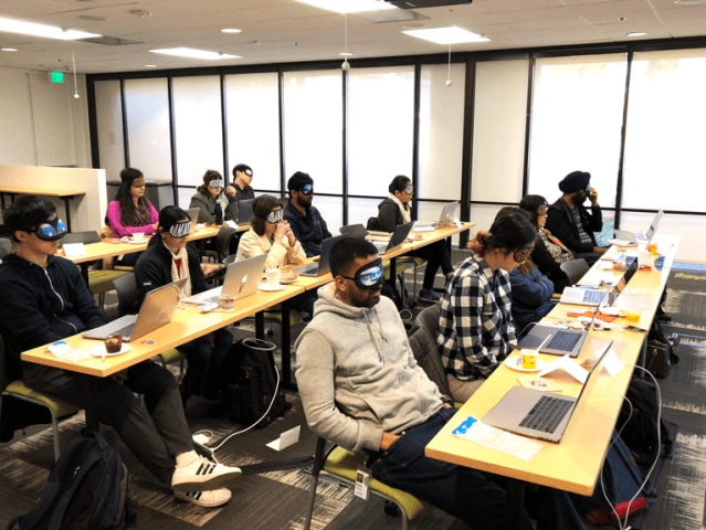 Some folks wear sleeping masks during an accessibility workshop, to feel what it’s like to have limited or no sight.
