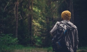 Man standing in the middle of a forest