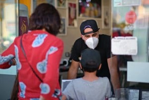 Freddy Papen, speaking with customers at Saffron and Rose Ice Cream