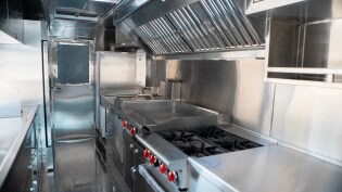 Industrial kitchen appliances in a food truck.