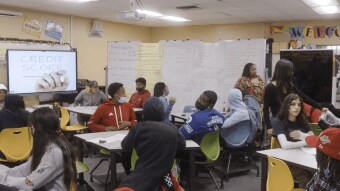 Students learn about credit scores in a financial basics course.