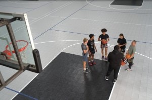 Fale coaching kids at the basketball court