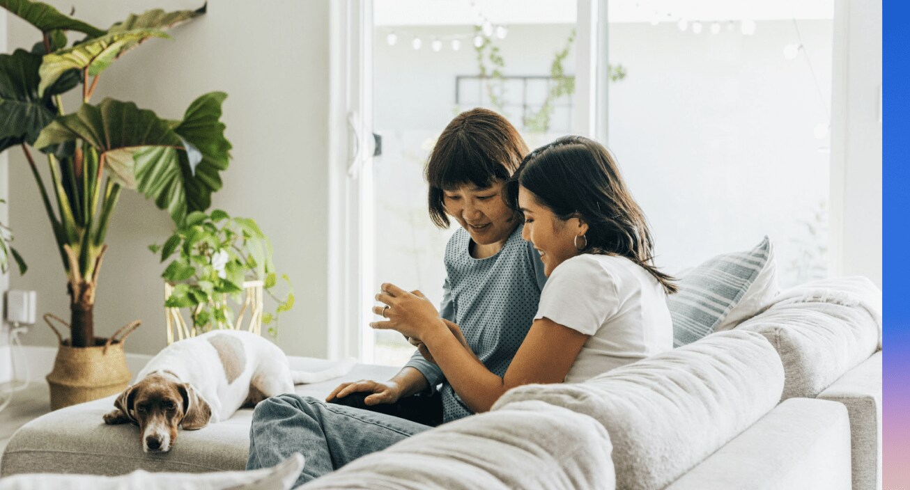 Image from the our 2022 Intuit DEI report with two women sitting on a couch