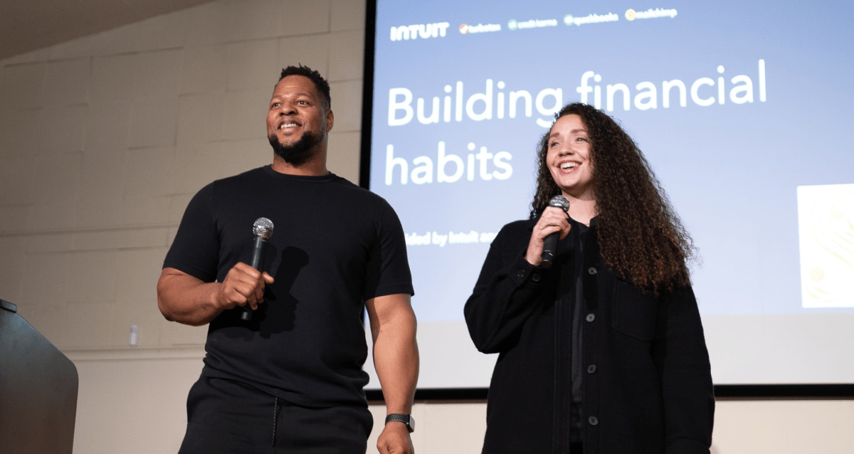 Ndamukong and Katya Suh on stage for one of our financial literacy workshops.