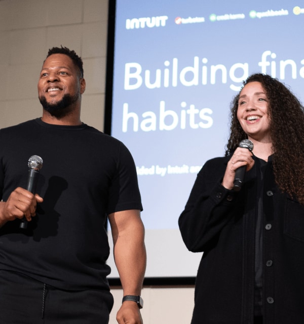 Ndamukong and Katya Suh on stage for one of our financial literacy workshops.