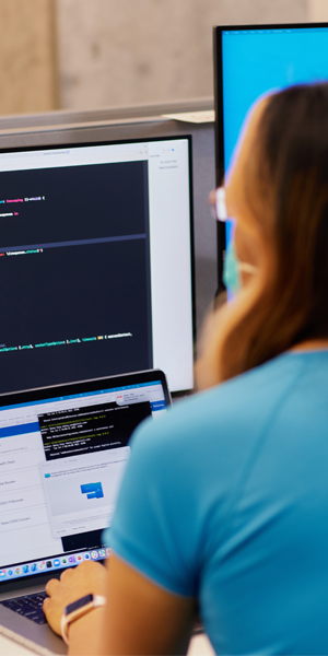 Intuit Tech employee sitting at her computer working