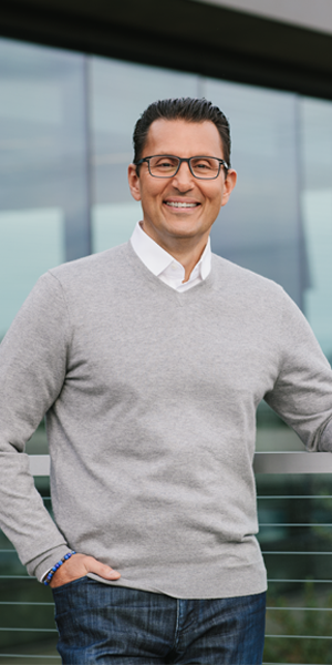 Intuit CEO, Sasan Goodarzi smiling at the camera