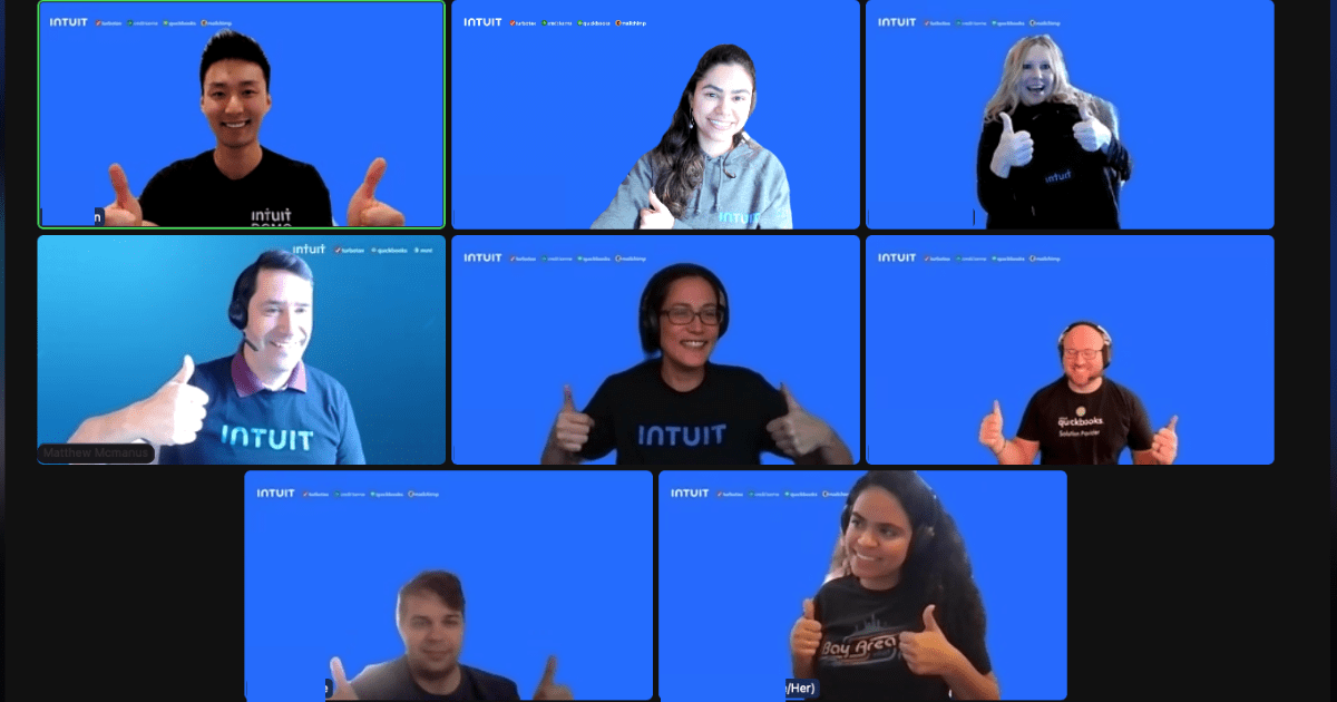 A screenshot of 9 employees from a Zoom call with blue backgrounds giving a thumbs up.