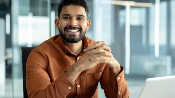 Professional individual sitting in a bright office setting
