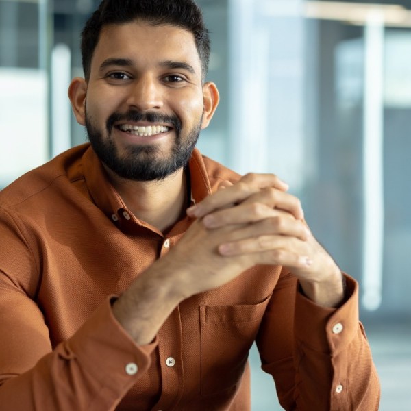 Professional individual sitting in a bright office setting
