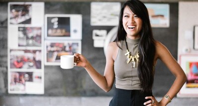 A business woman holding a cup of drink A business woman holding a cup of drink