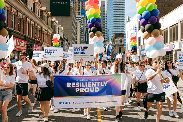 A large group of people marching down a street.