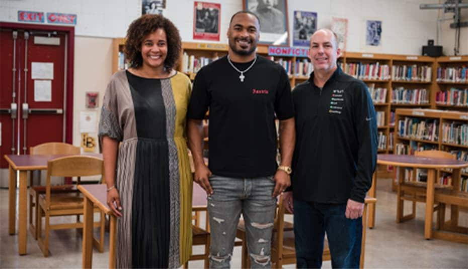 Photo of David Zasada, Dr. Silke Bradford, and Robert Woods in a Compton High School library 