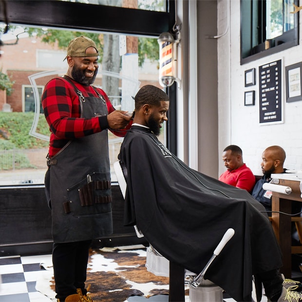 Barber cutting a customers hair