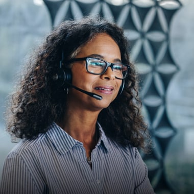 Intuit Expert wearing an headset and smiling 