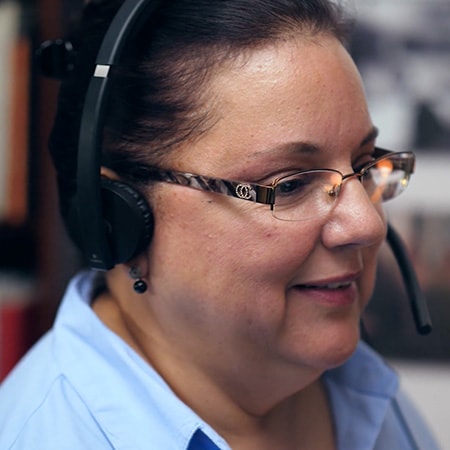 Intuit employee talking on a headset 