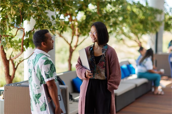 colleagues-chatting-balcony-photo-icom-desktop-680x453.jpeg Image Alt Text
