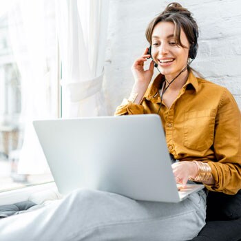 Everything Starts with the Customer Employee talking on laptop