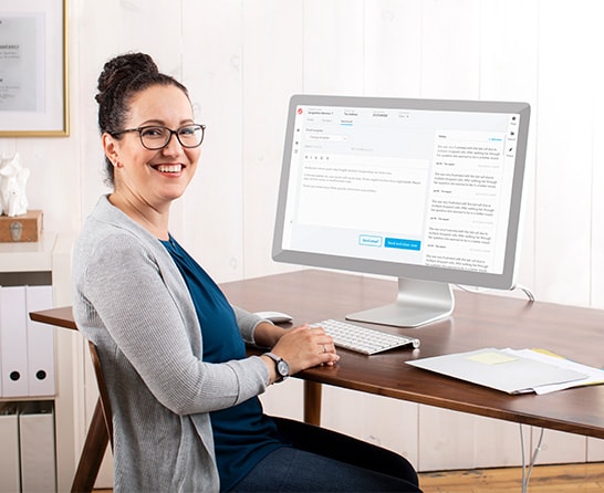 Intuit Expert working from her home office, smiling at the camera 