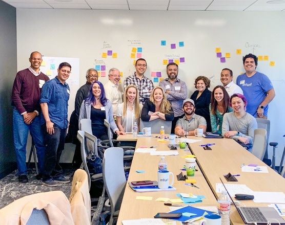 Employees taking a photo in a meeting room