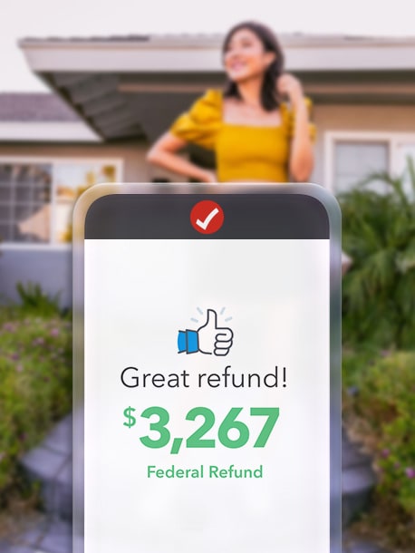 A device showing TurboTax with a woman standing behind it