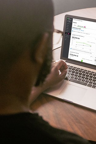 A person sitting in front of his laptop