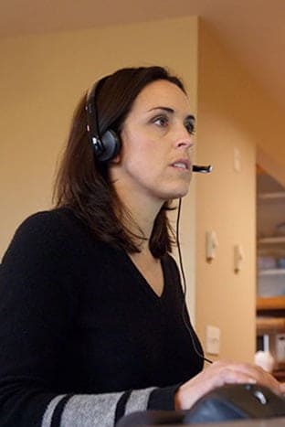 A person is talking with a headset on