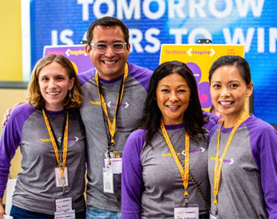Employees gathering for a photo at TechCon