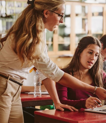 Teacher talking to student