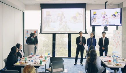 Male students doing a presentation