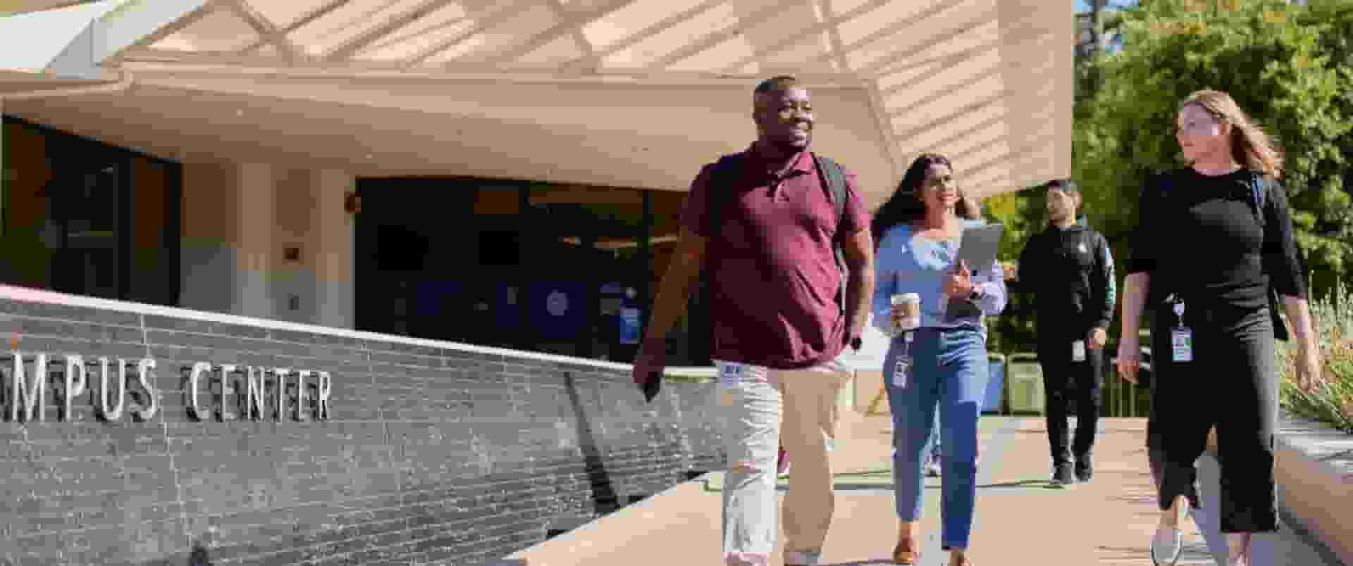 Intuit employees walking down the campus ramp