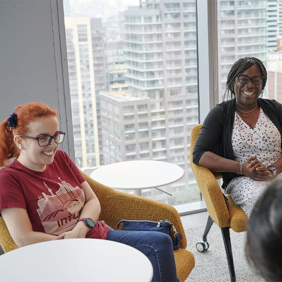 Female colleagues smiling during a meeting