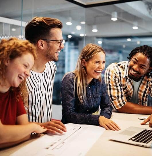 A group of people smiling and laughing