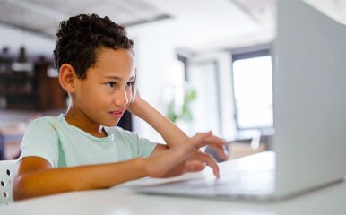 Kid using a laptop