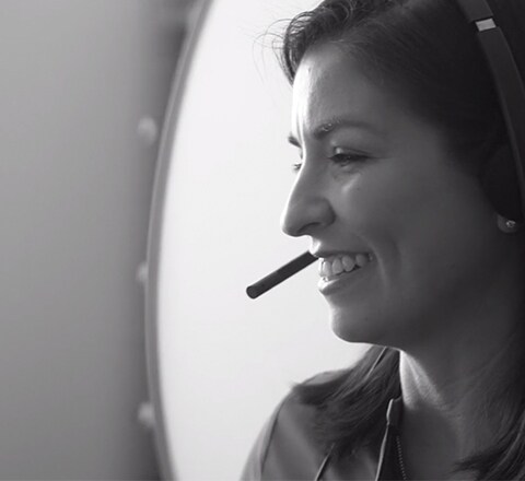 Intuit employee talking on a headset 