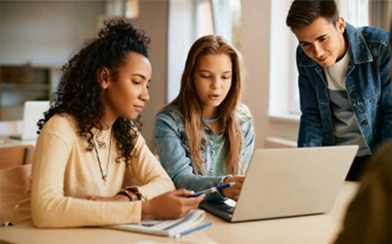 High school students e-learning on laptop