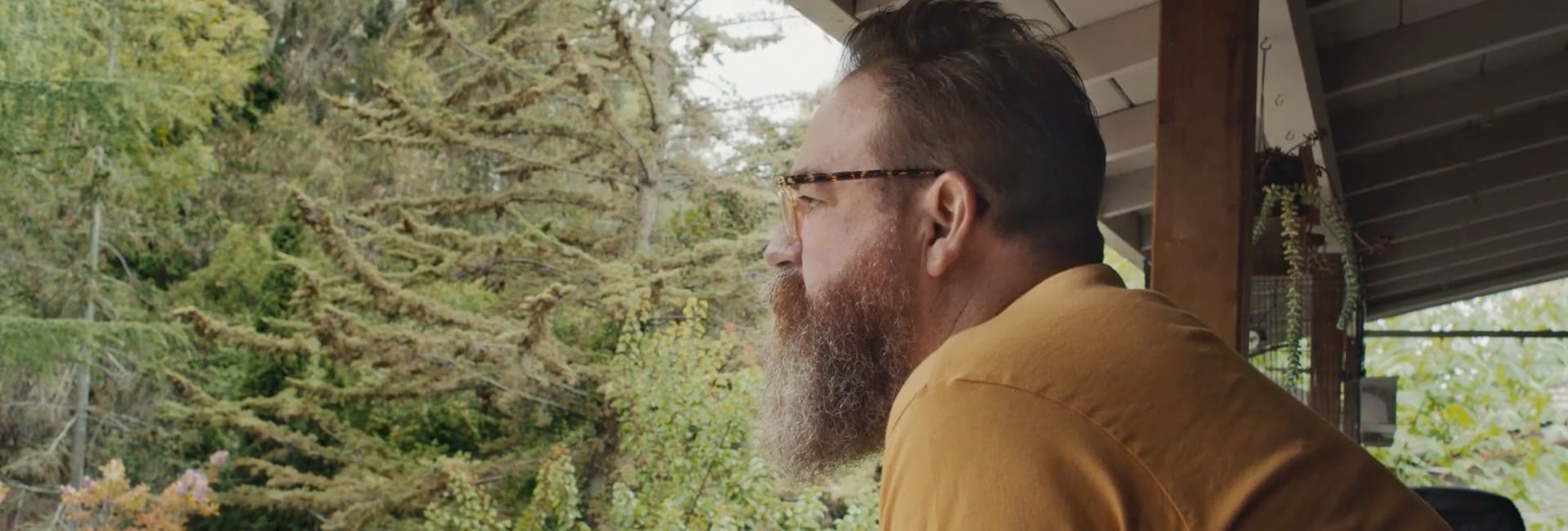 Paul overlooking on a balcony