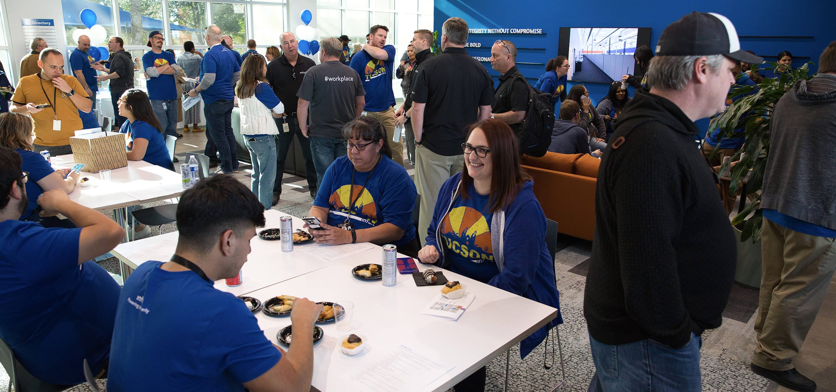 A group of people sitting around a table.
