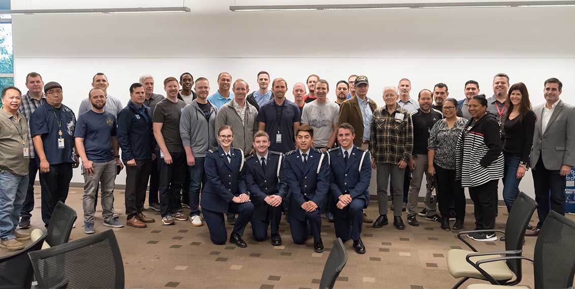 Veterans posing with active members on the San Diego Campus