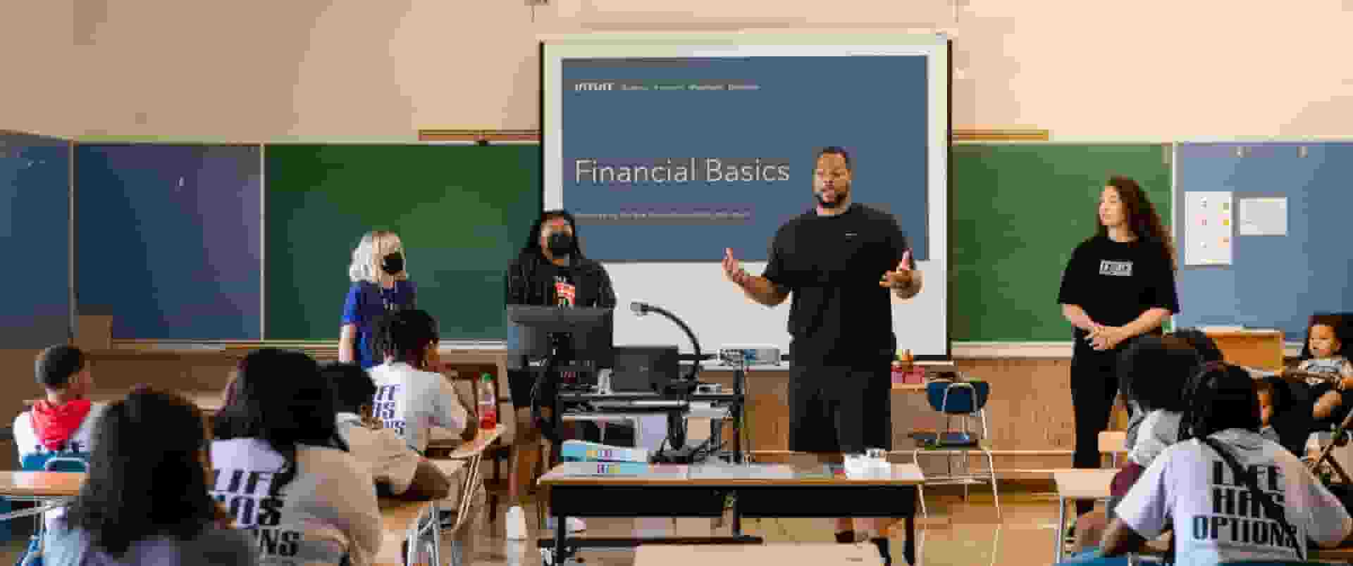Ndmukong Suh speaking in front of a group of students