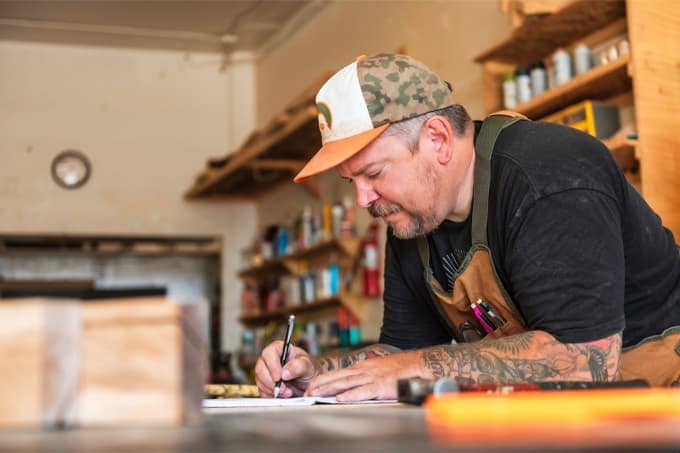 Small business owner working at his store