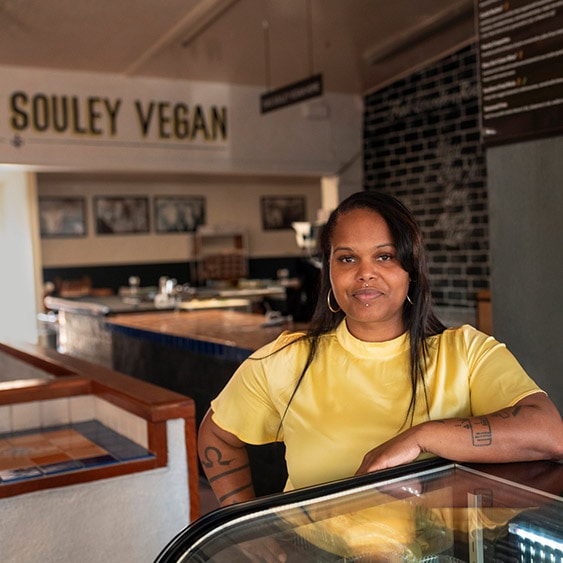 A woman posing in her restaurant, Souley Vega