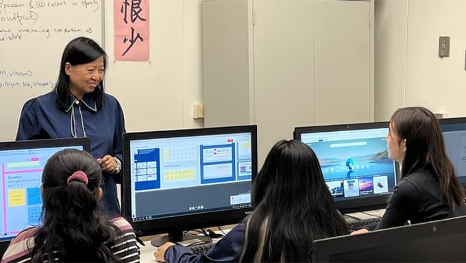 Students in a classroom in front of computers