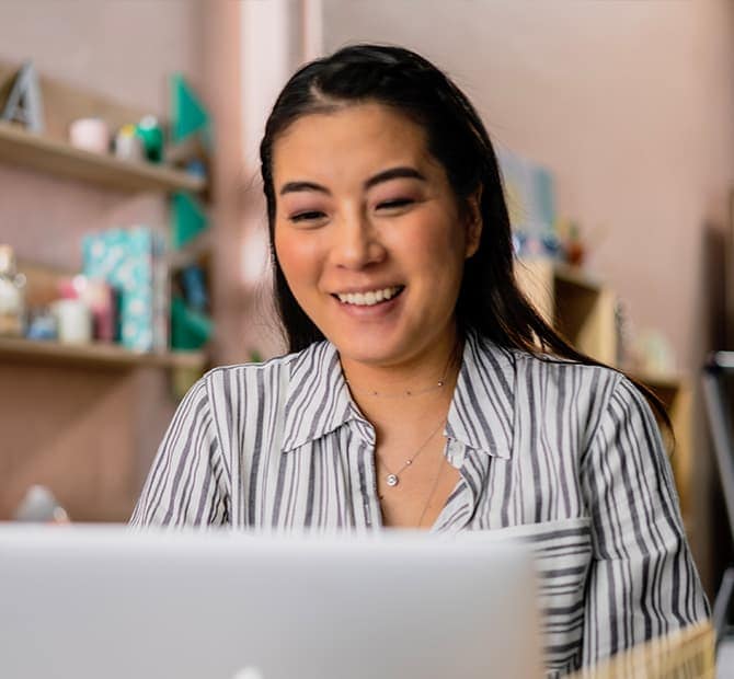 Person on a laptop smiling