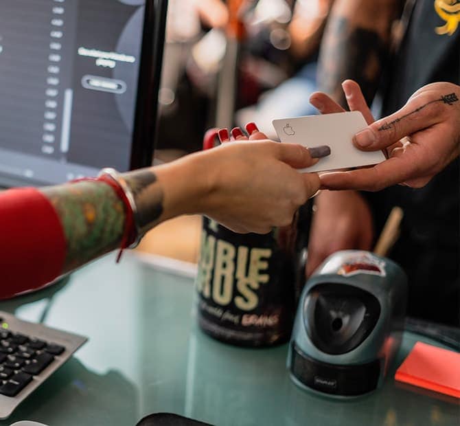 Merchant handing a credit card back to a customer