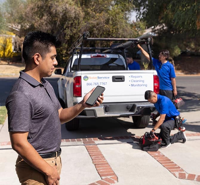 Service folks unloading a pickup truck