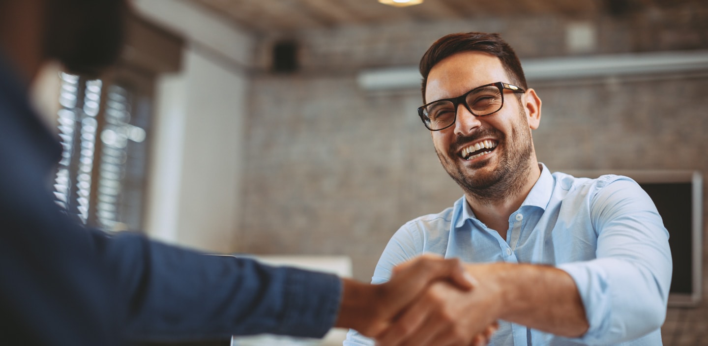 Close up of handshake in the office