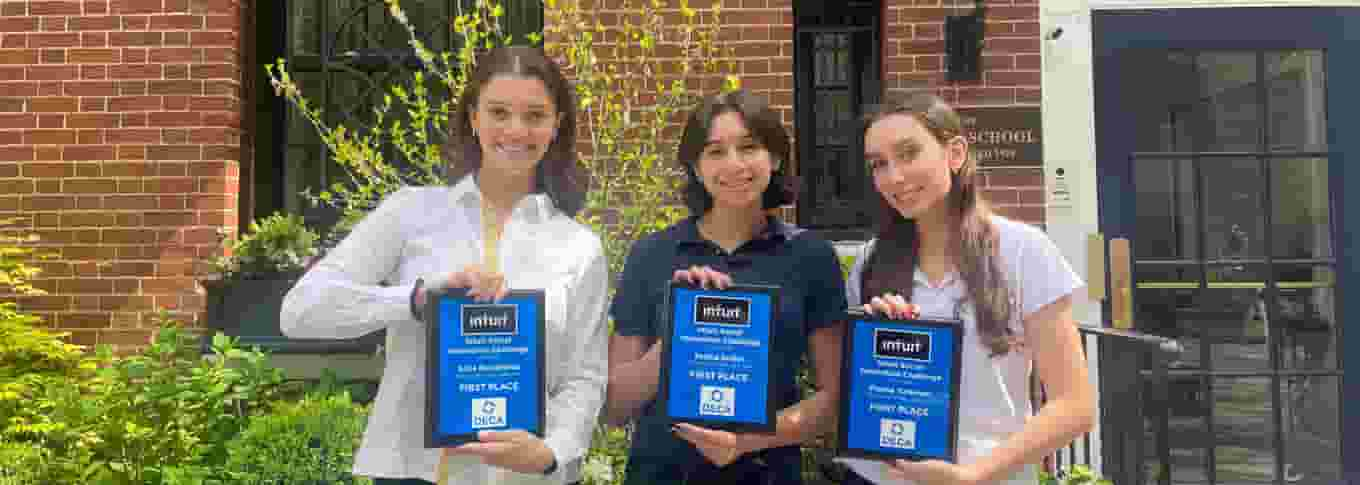 Team Early Entrepreneurs holding plaques