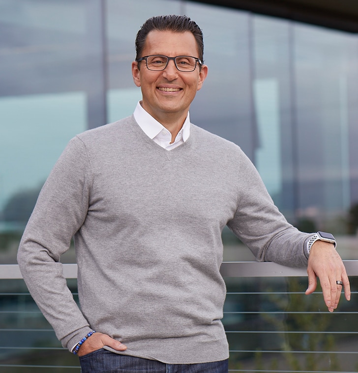Intuit CEO Sasan Goodarzi wearing a grey sweater 