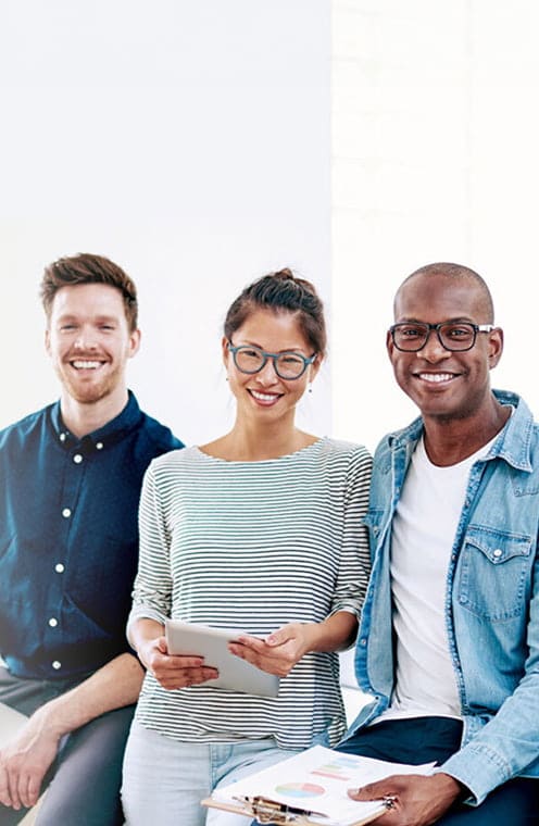 3 people sitting and smiling